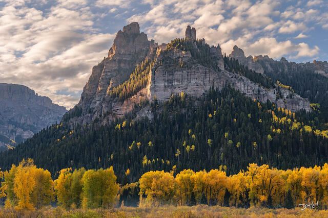 Pinnacle Ridge at sunrise with autumn trees in Colorado, USA.