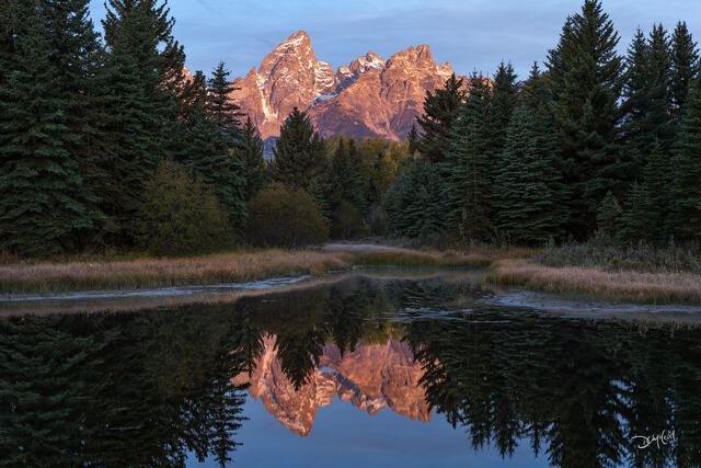 Schwabacher Landing at sunrise with Teton Range reflection in Wyoming.