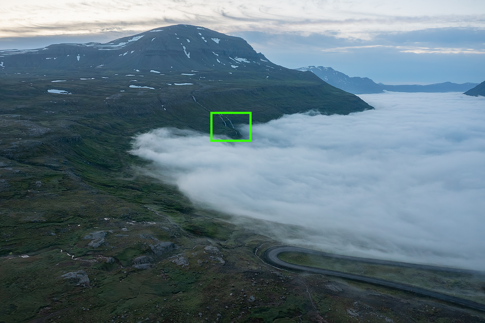 Drone image of a cloud inversion over a fjord in Iceland.