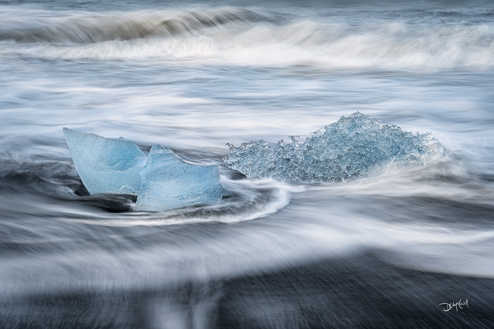 Frozen in Time Ancient chunks of blue ice stranded on the black sand of Diamond Beach in Iceland.