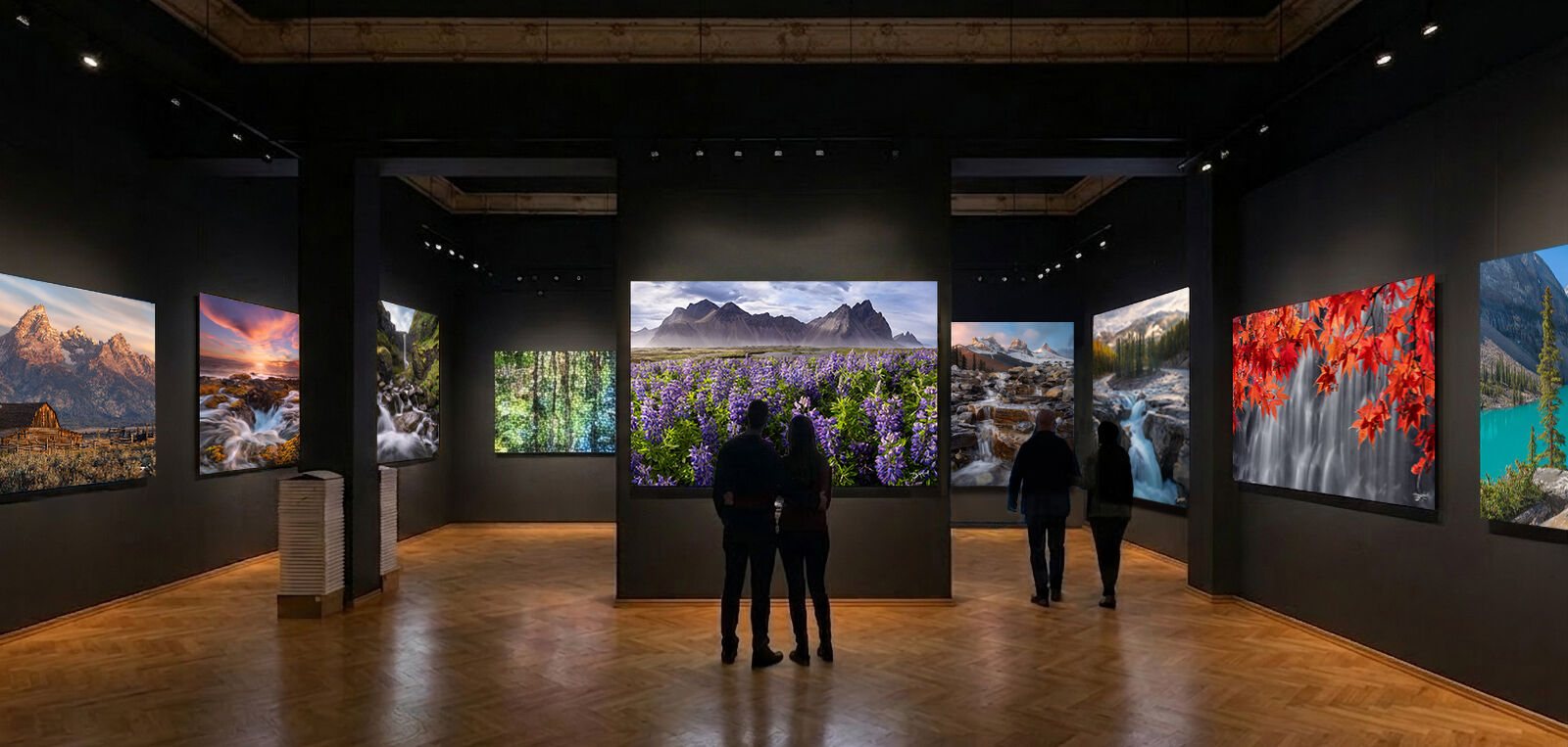 Tourists enjoying large gallery with acrylic face mount landscape prints.
