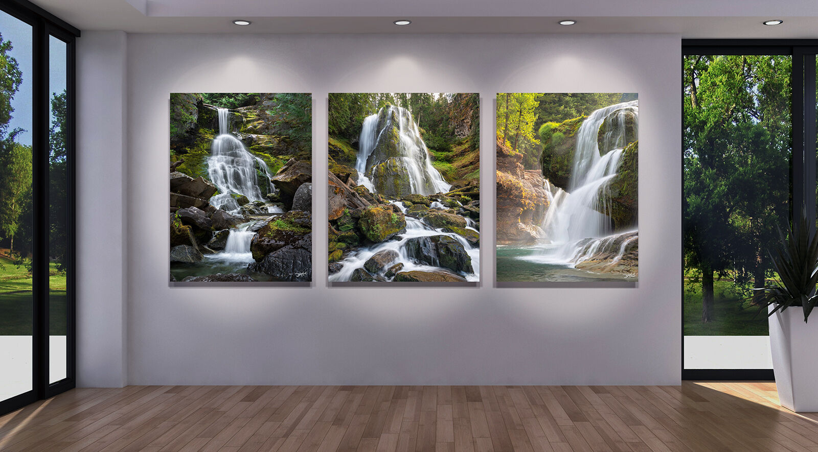 Three waterfall prints hanging side by side on a large gallery wall.