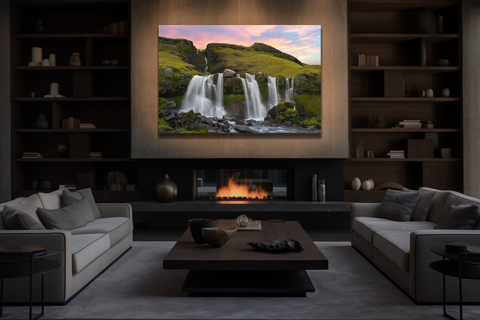 A large photographic print of Gluggafoss waterfall in Iceland hangs over a fireplace.