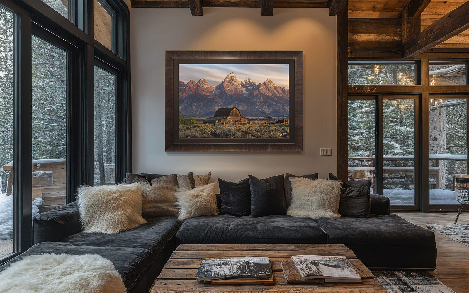 A large Roma framed photograph of John Moulton Barn hangs on a wall over a sofa in a modern rustic mountain home.