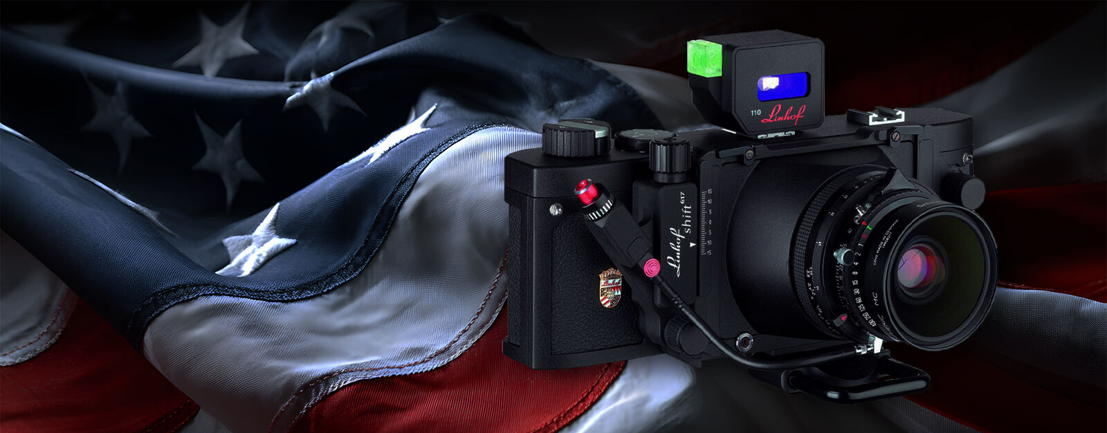 Graphic image of a Linhof Technorama camera superimposed over an American flag.