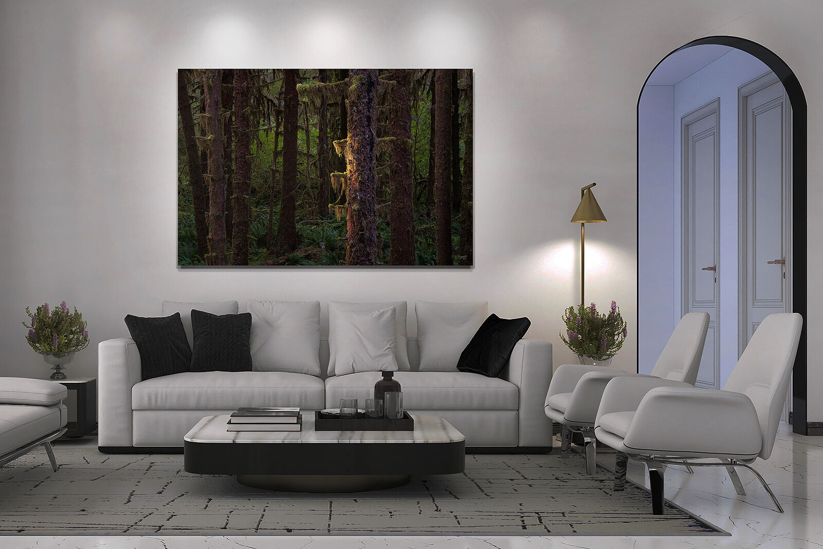 A photographic print of a forest hangs on the wall of a living room with white furniture.