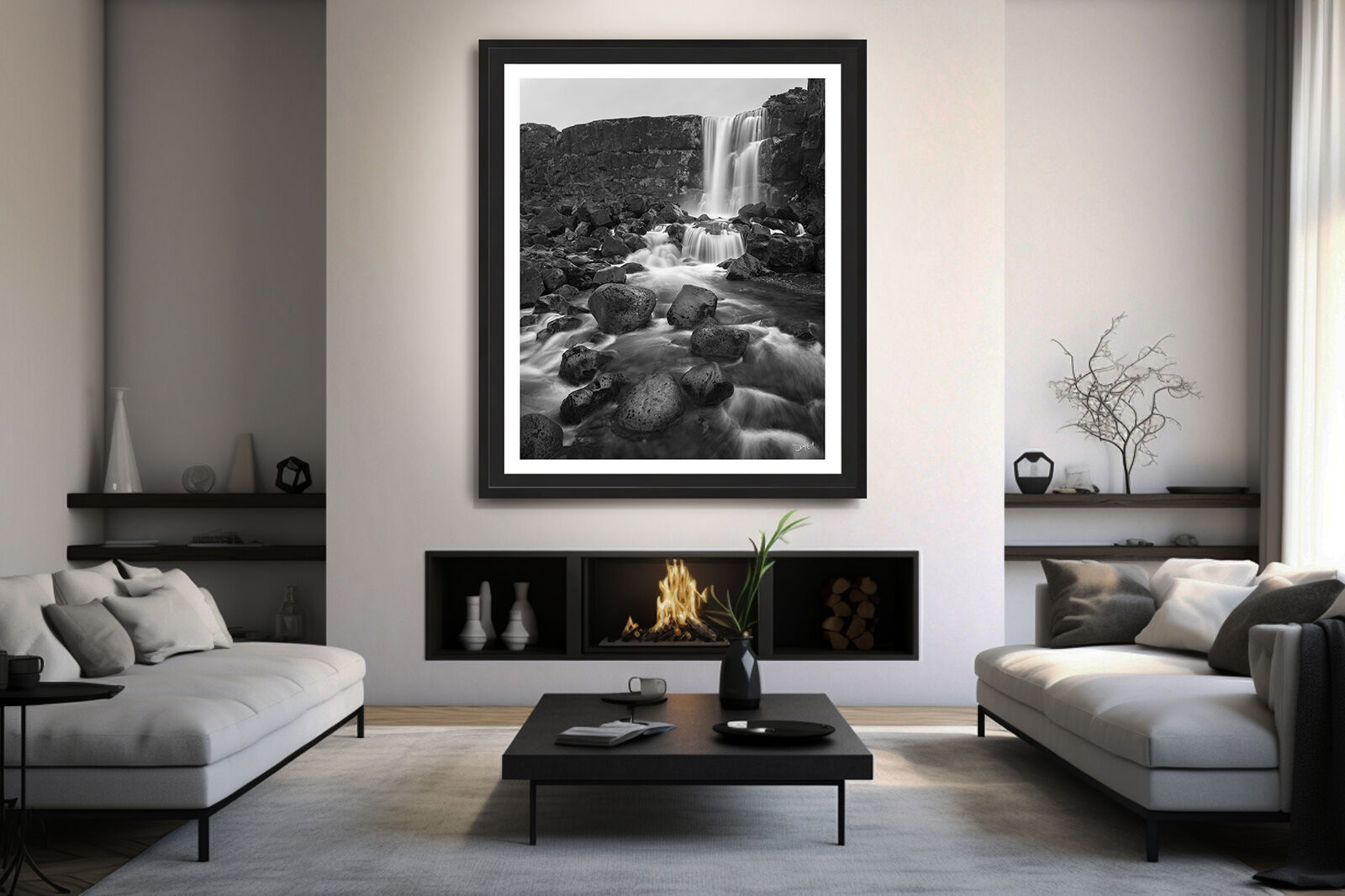 A large, custom framed photographic print of Öxarárfoss waterfall in Iceland hangs in an upscale, minimalist living room.