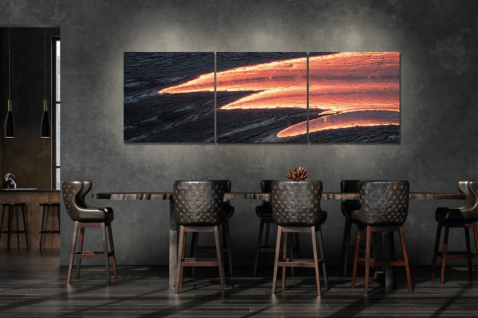 A giant oversized panoramic photograph of flowing lava hangs on the wall over a large dining table in an industrial loft.
