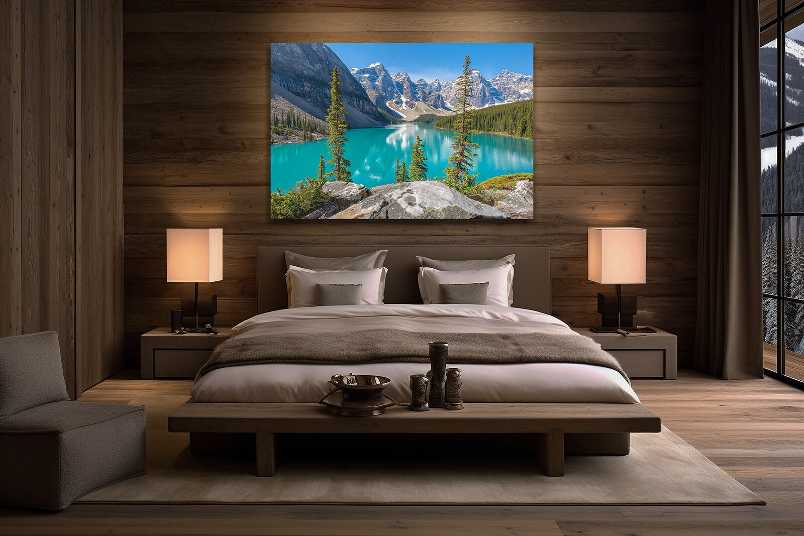 A large photographic print of Moraine Lake hangs over a bed in an upscale home.
