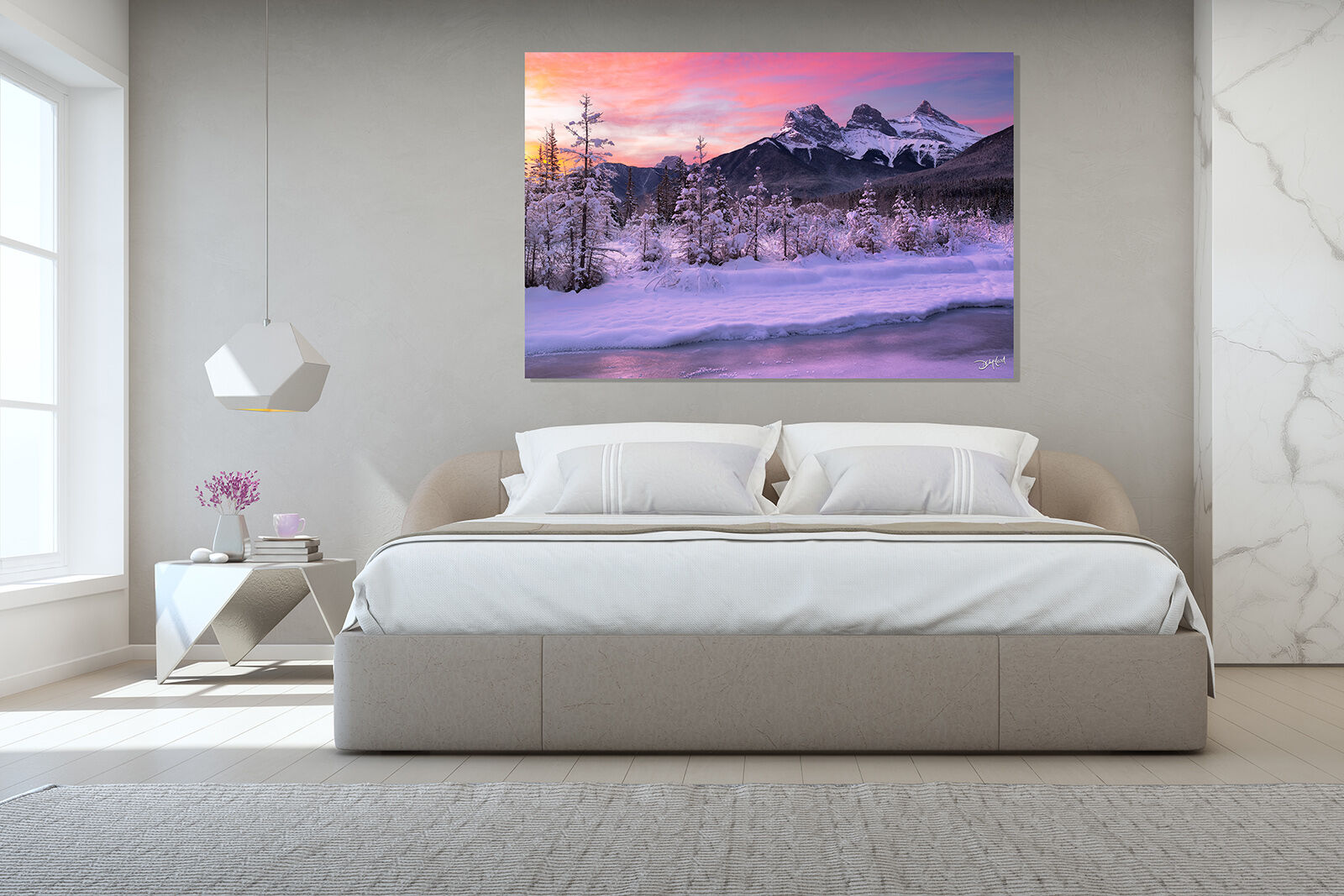 Three Sisters mountain during colourful sunrise in winter, Canmore, Alberta