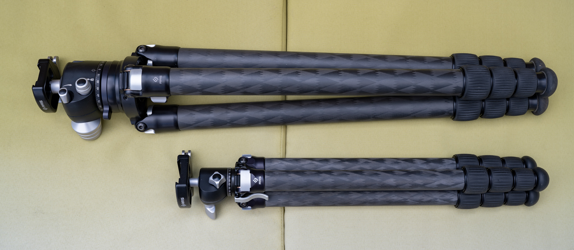 Two carbon fiber tripods for aurora photography, one small, one large.