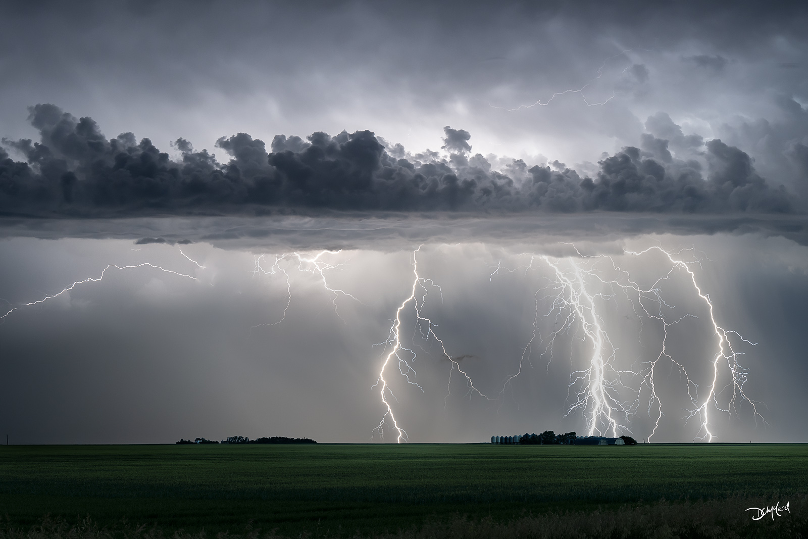 Lightning storm over prairie farmland in Saskatchewan, dramatic fine art landscape photography print.