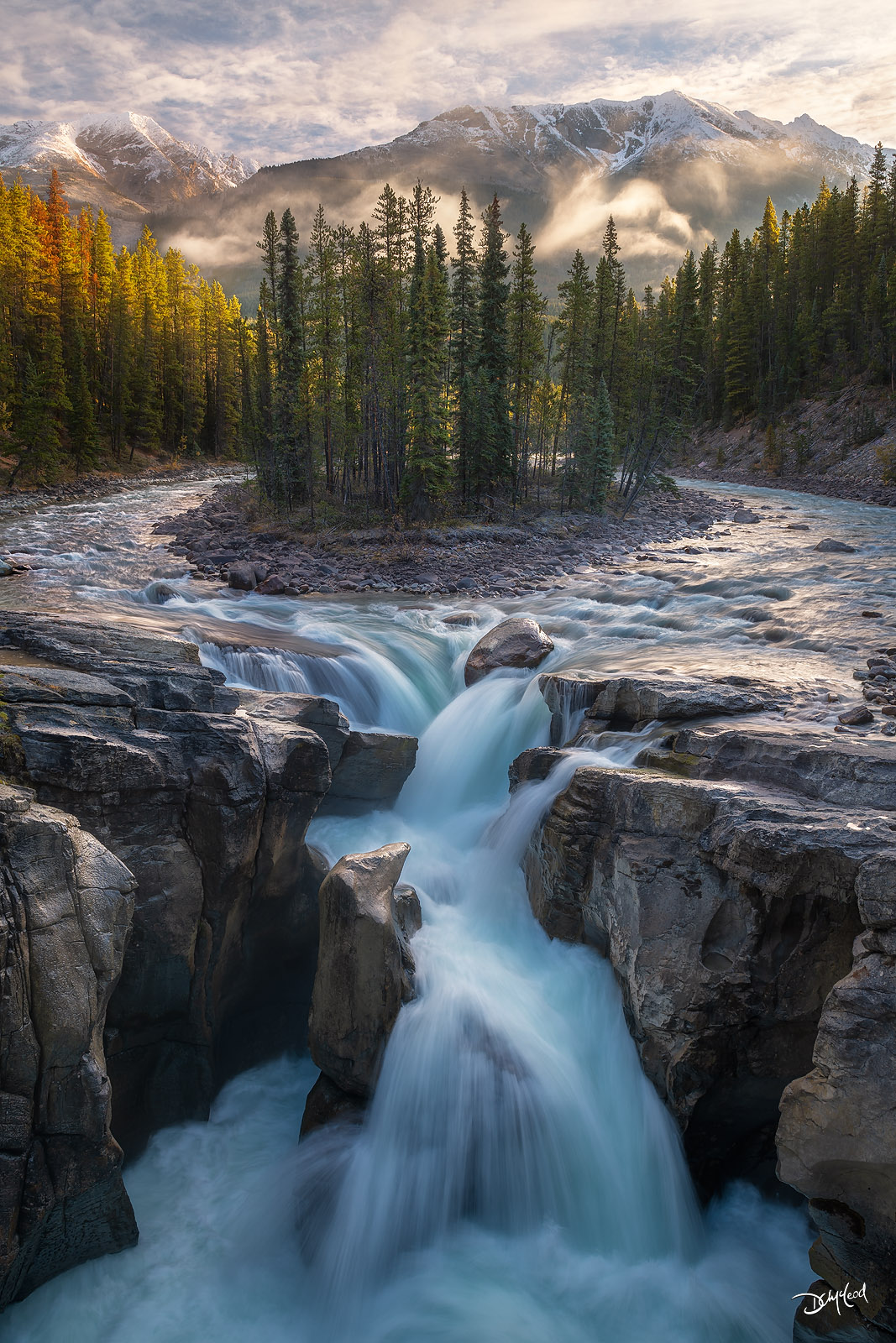 Sunwapta Falls in Jasper National Park with fog and morning light, fine art landscape photography print.